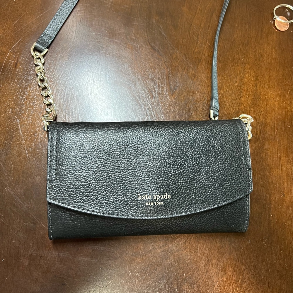 Small black Kate Spade crossbody purse with gold chain accents & blush interior